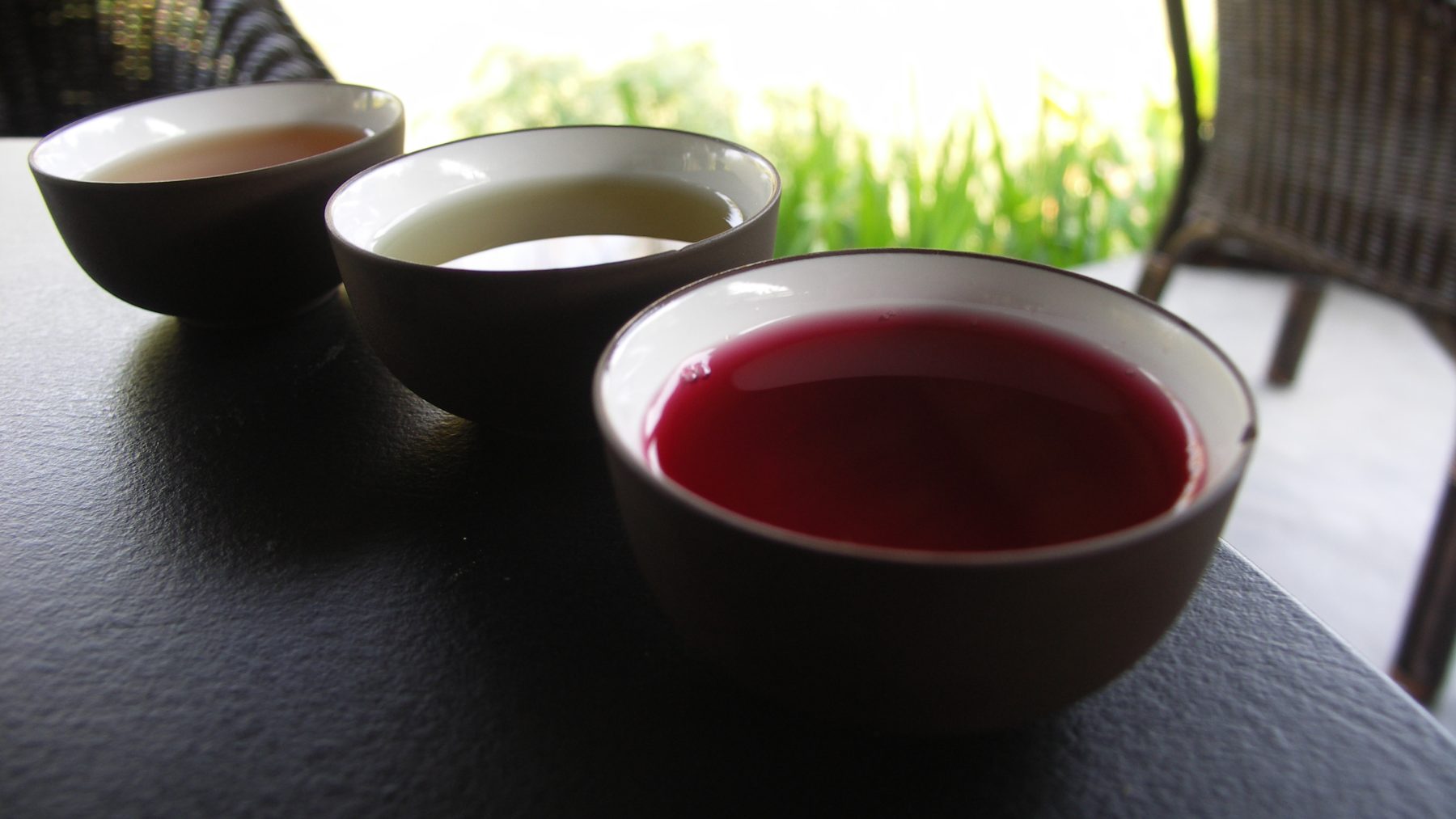 Tea taster cupping and evaluating liquor samples
