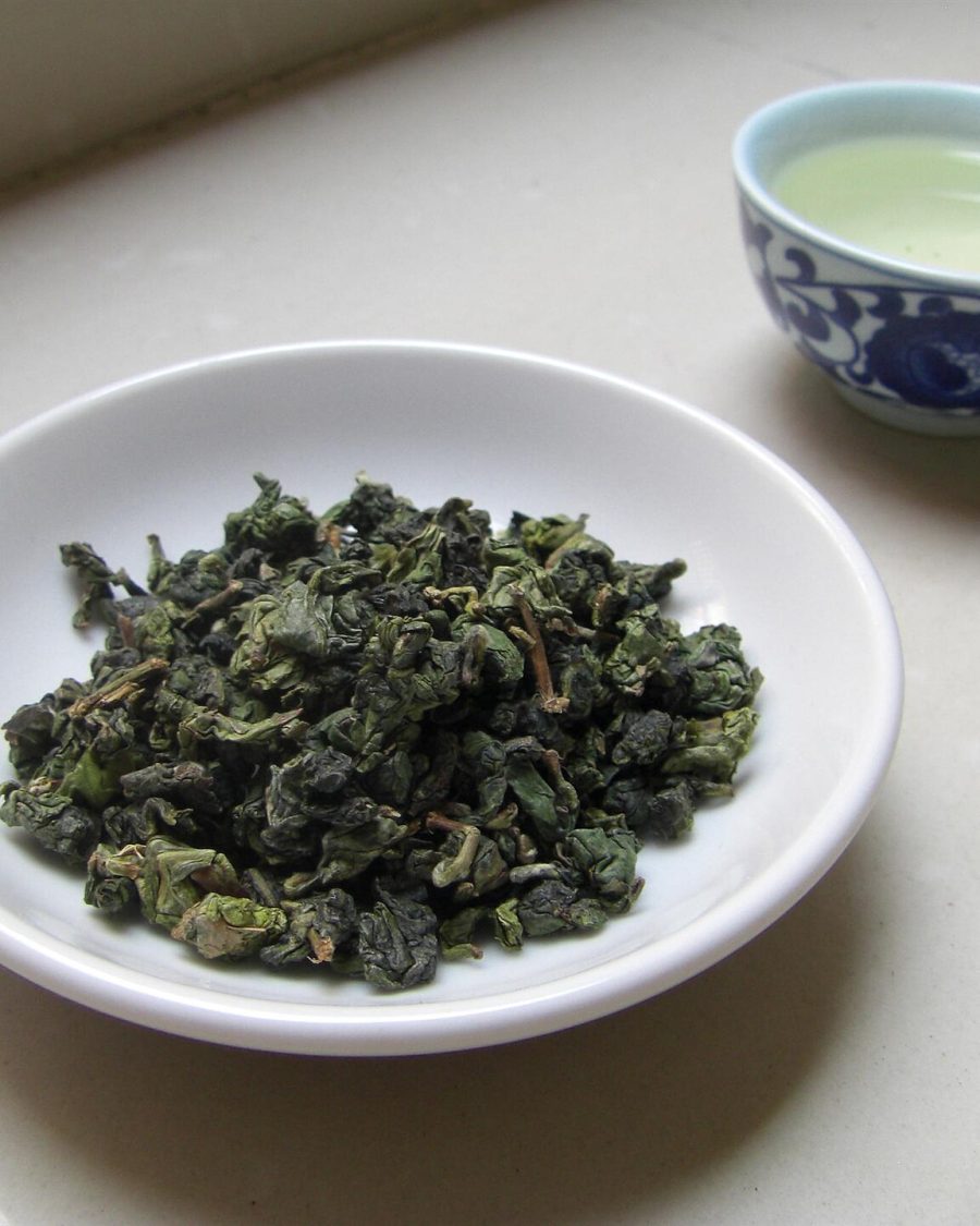 Rolled ball-shaped oolong tea leaves, tight green pellets